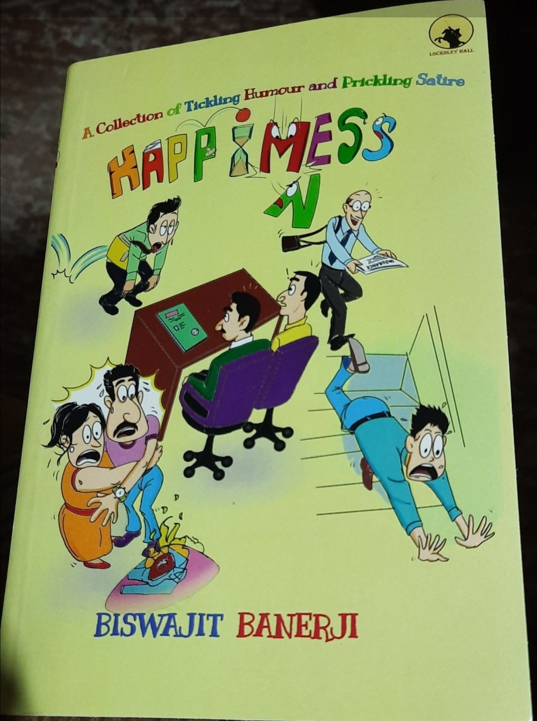 “Happimess” by Biswajit Banerji: A Satirical and Humorous Short Story Collection